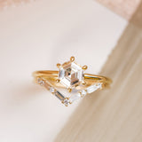 14k yellow gold hexagon diamond ring with 6 prongs, paired with V-shaped diamond wedding band