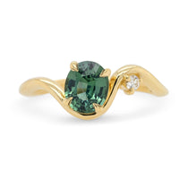 Sculptural 14k yellow gold oval teal sapphire and white diamond engagement ring