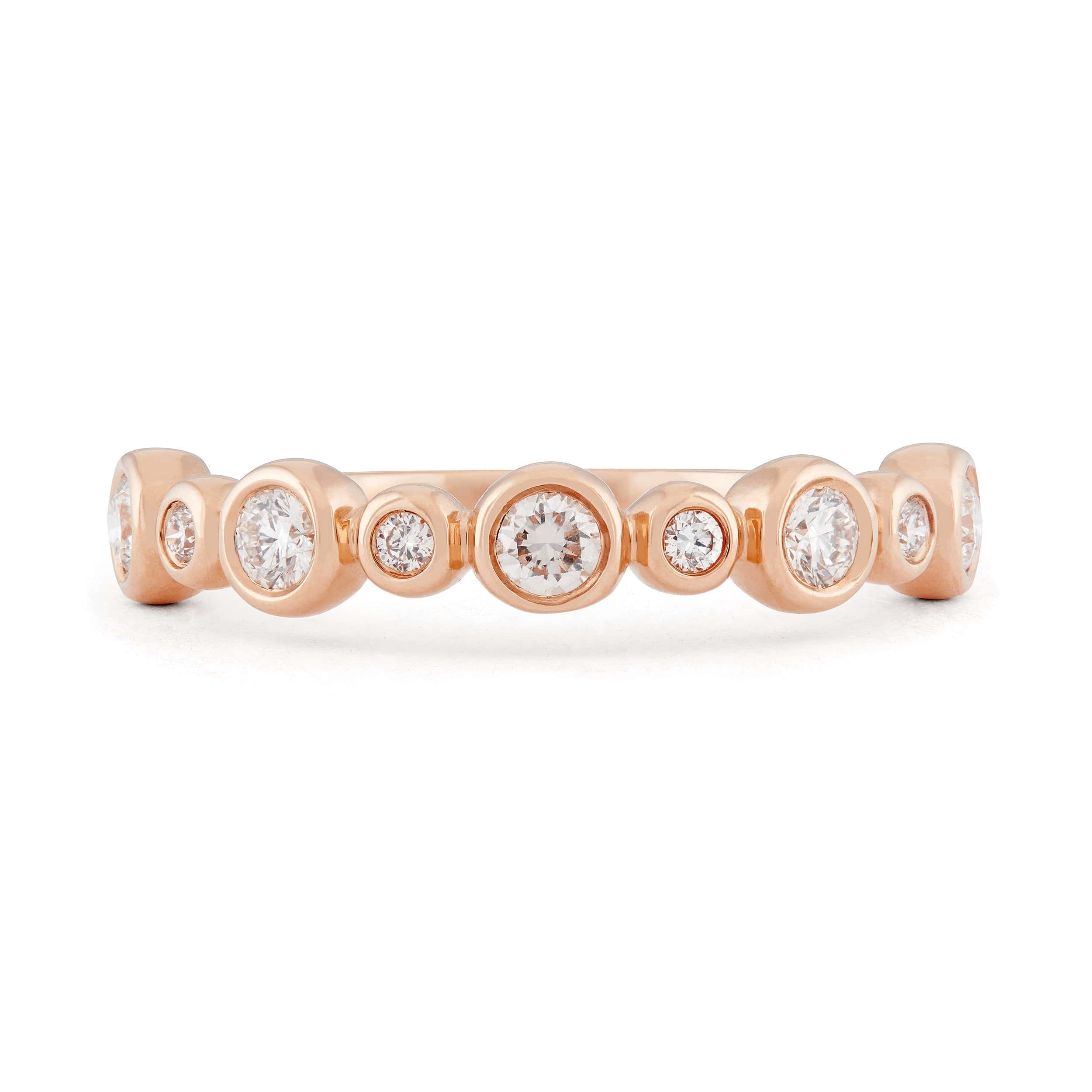 Diamond and 14k rose gold bezel set wedding band 