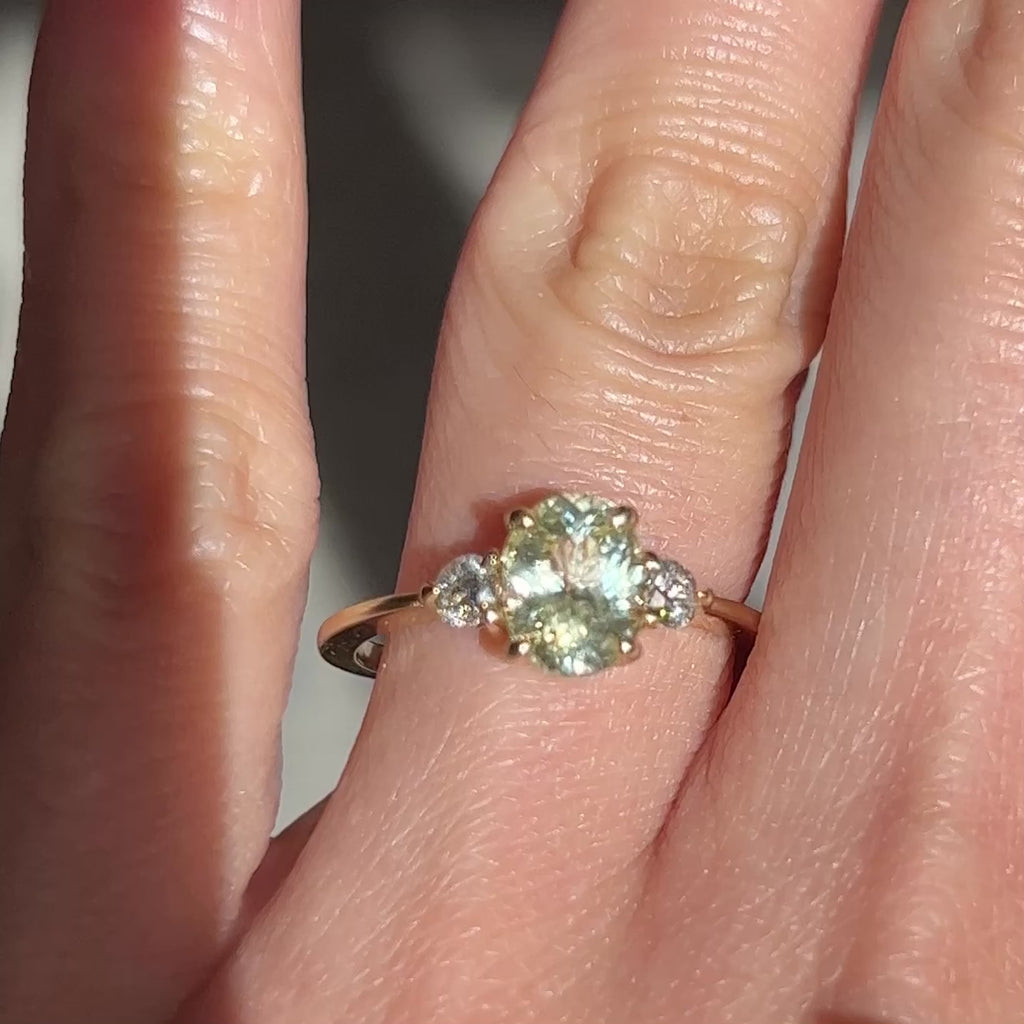 video of 14k yellow gold engagement ring with yellow oval-cut sapphire and diamonds